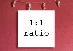 Square 1:1 mockup board hanged on a red / magenta wall.