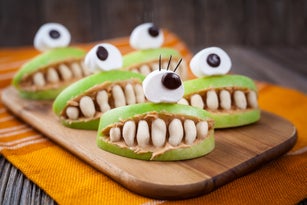 Spooky halloween edible apple monsters healthy natural dessert. Horror party