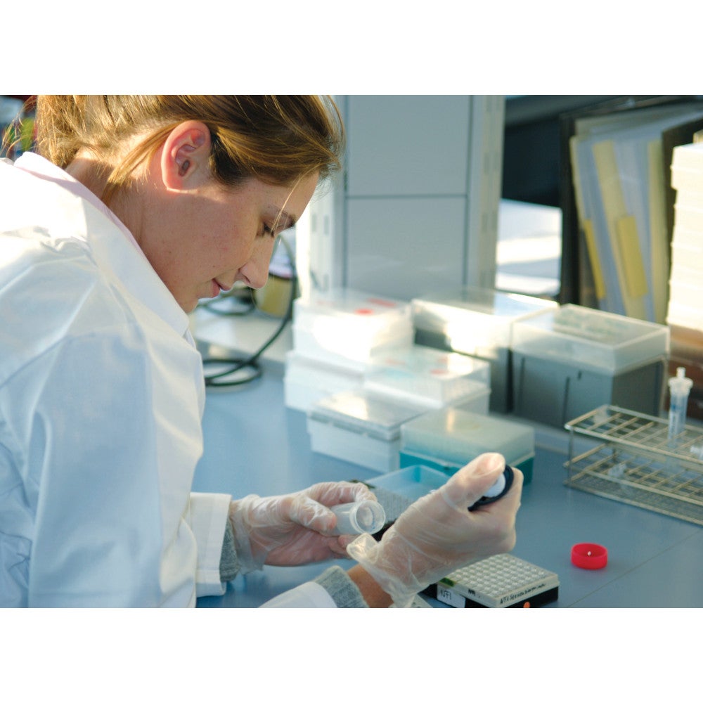 Lab assistant working with a ZEISS microscope