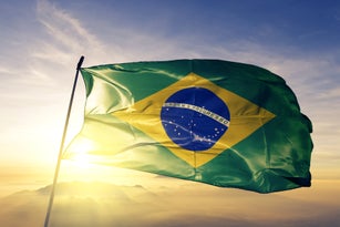 Brazil Brazilian flag textile cloth fabric waving on the top sunrise mist fog