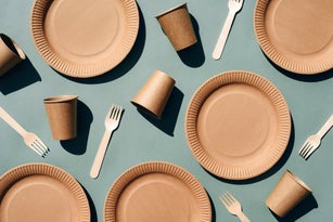 Craft dishes on a green background.