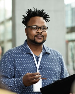 Male entrepreneur wearing eyeglasses in seminar