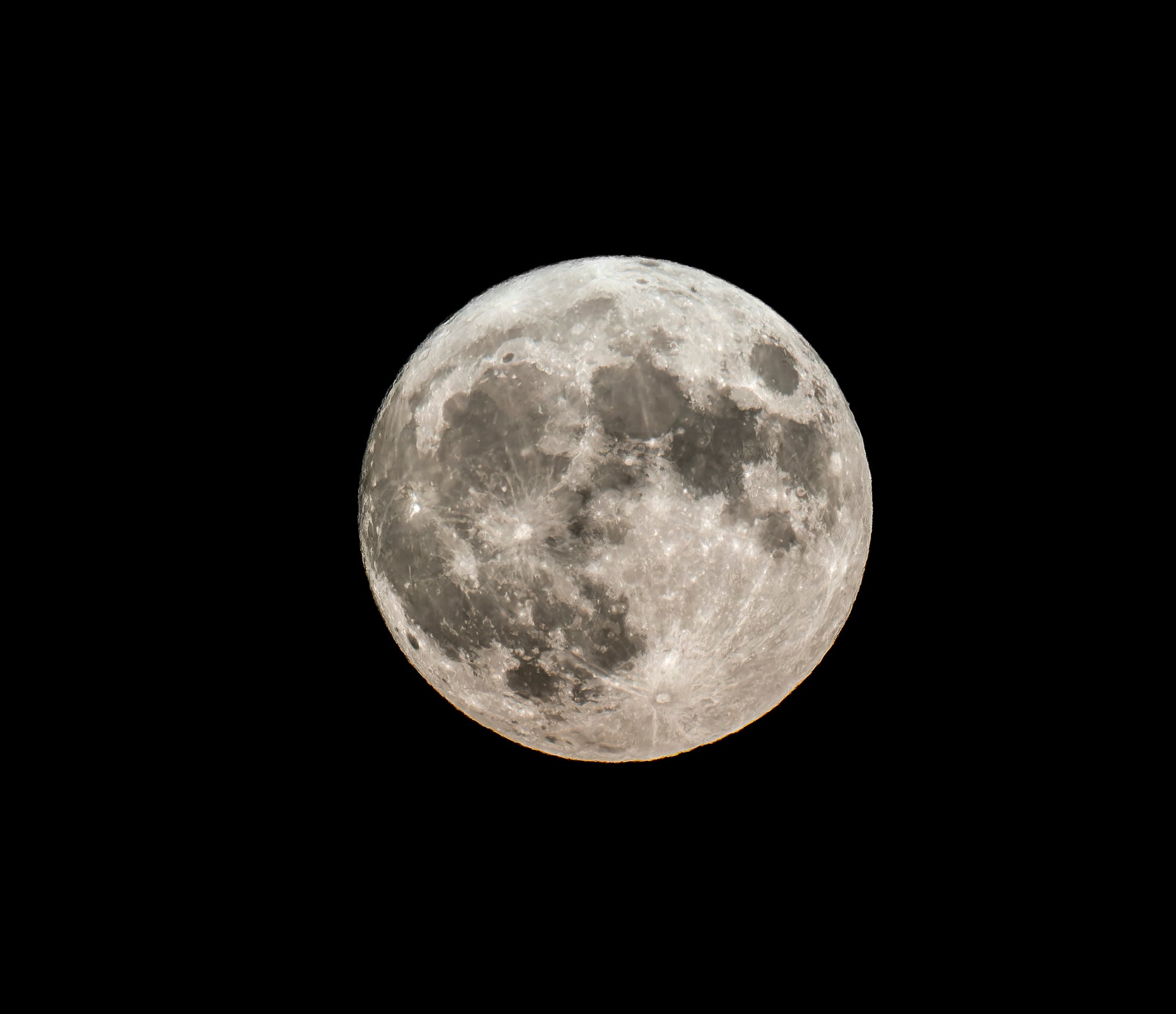 Full moon over a dark sky.