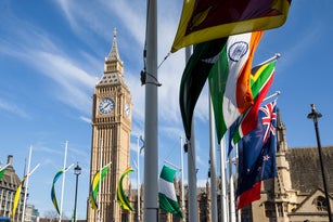 Big Ben clock tower and flags from the Commonwealth of Nations