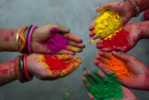 Hand with colours at Holi festival,India.