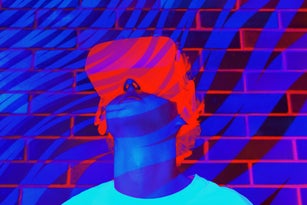 Young man or teenager in a white t-shirt wearing virtual reality Headset during the VR experience.