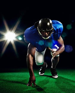 American football player crouching