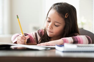 Mixed race girl doing homework