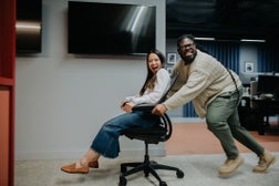 Comical image of the late night antics of two misbehaving office workers