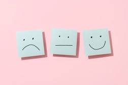 Three Blue Sticky Blank Notes On Pink Background