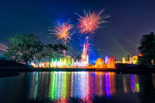 Ancient pagoda with light and sound show with fireworks in Ayutthaya Historical Park Thailand at Ayutthaya World Heritage Fair. Ayutthaya Historical Park was declared a UNESCO World Heritage Site.