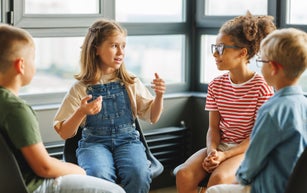 Group work of school children, students discuss a collective project at school