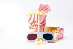 Bucket of Popcorn With Cinema Tickets and 3D Glasses on White Background.