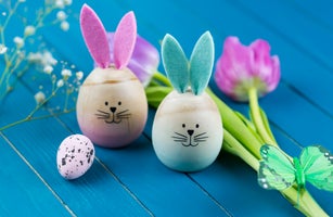 Two painted Easter eggs with rabbit ears