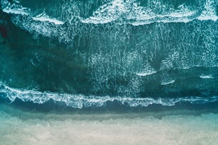 Beach seen from above - waves hitting the beach