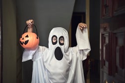 Trick or Treat; little boy dressed as a ghost