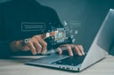 Man interacting with AI chatbot prompt on laptop representing artificial intelligence, generative technology, virtual assistant, smart content creation interface, and modern multimedia innovation