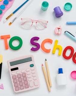 Back to school concept. Creative composition of school stationery  on a white background. Top view, flat lay.