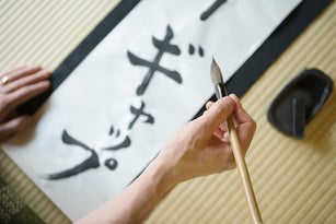 Man writing in Japanese script