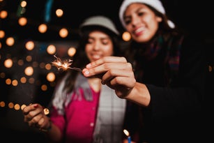 Mexican Posada, group of friends with sparklers in Christmas in Mexico