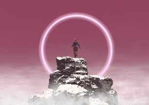 Woman on top of the mountain looking at halo