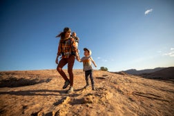 A mother and hiking with her two kids.