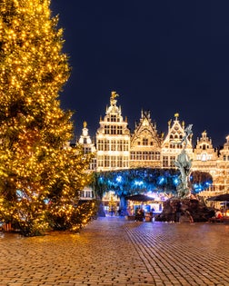 Illuminated Christmas tree and Christmas market at Grote Markt, Antwerpen, Belgium