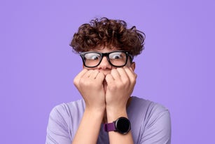 Scared teenager biting nails