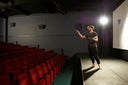 Actor rehearsing on stage.