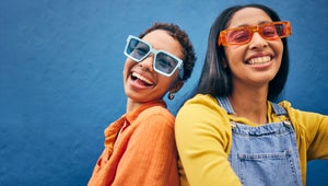 Sunglasses, fashion and portrait of friends on blue background with trendy clothes, accessories and style. City, summer clothes and face of happy women with smile on holiday, vacation and weekend