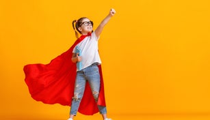 Little superhero studying at school