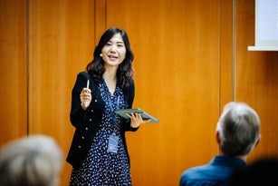 Businesswoman Giving Talk At Business Conference