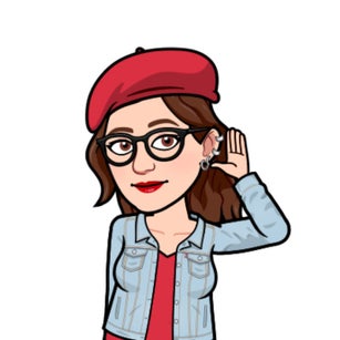 Teacher with hand cupped to her ear listening 