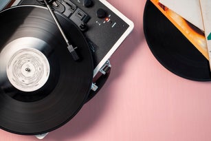 Turntable with a spinning vinyl record.