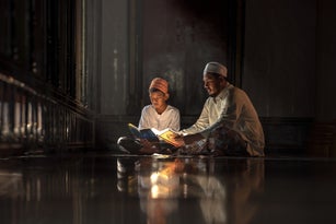 Asia muslim reading quran in mosque. islamic concept.
