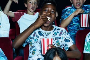 Group of children enjoying a movie at the cinema
