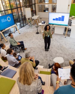African woman addressing audience at startup launch event
