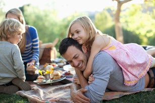 Family picnicking together outdoors