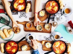 Friends having brunch at the restaurant, directly above view