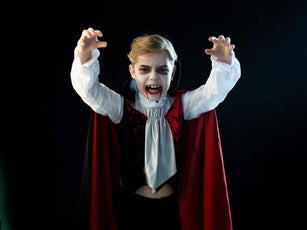 Boy wearing Halloween vampire costume