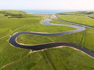 Elevated view over bend in a river at Beachy Head