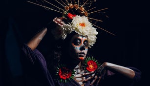 Woman with mexican halloween makeup on her face