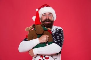 Love giver more than gift. Bearded man hug toy with love. Happy hipster celebrate new year and xmas. I love Christmas. Christmas is about love
