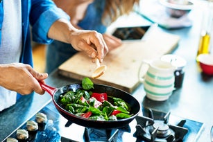 Man frying vegetables