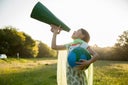 Female Eco-warrior shouting into a megaphone