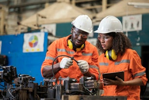 Alignment and assembly jigs developed to boost quality and efficiency in an auto parts manufacturing Industry. Two African American Process Engineers discussions on assembly jig and verify the dimensional accuracy of the fixture to increase durability.