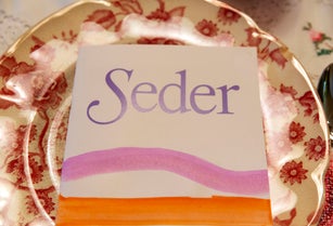 Closeup of a hand painted family Seder Haggadah