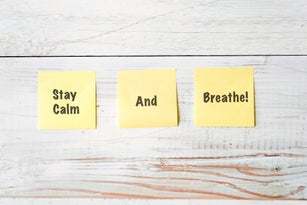 Three Yellow Post It notes with Message Stay Calm and Breathe!