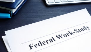 Federal Work Study FWS program documents and pen.