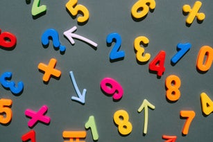 Multicolored numbers on a black background. Education. Mathematics. Finance. Economy. Money.
